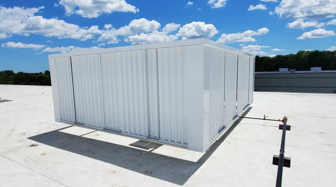 rooftop equipment enclosures on a commercial flat roof